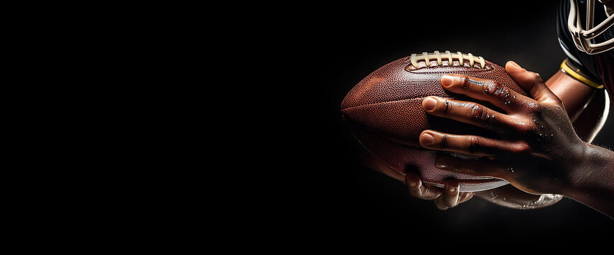 Extreme close-up of the hands of American football player holding a football ball against a black dark background with copy space. Template or empty banner for American football sport. Generative Ai.