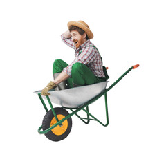 Funny gardener inside a wheelbarrow