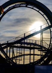 Roller coaster silhouette late in the afternoon on Palace Pier in Brighton, UK