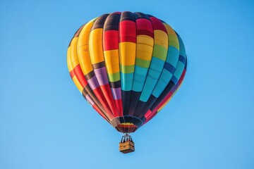 Naklejka premium A vibrant hot air balloon soaring through a clear blue sky on a sunny day