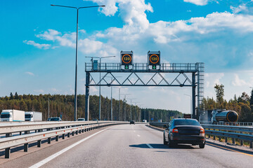 Traffic information system on highway. Speed limit sign. Highway asphalt road with cars and trucks...
