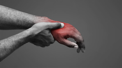 Close up of afro man massaging his highlighted hand, osteoarthritis concept