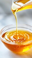 Fruit extract being poured into a mixing bowl.