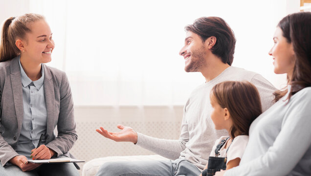 Portrait Of Happy Family After Successful Session With Marriage Counselor, Found Solution For Their Problems, Free Space