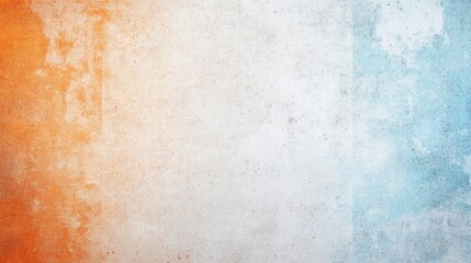 Fototapeta premium A textured abstract background featuring a blend of orange and blue tones, creating a soft, faded appearance.