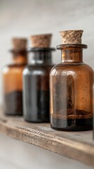 Shelf with various coffee extracts in dark bottles.