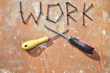 word work made of screws and two screwdraveers