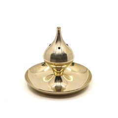 golden stand for ceremonial agarbatti incense sticks isolated in a white background