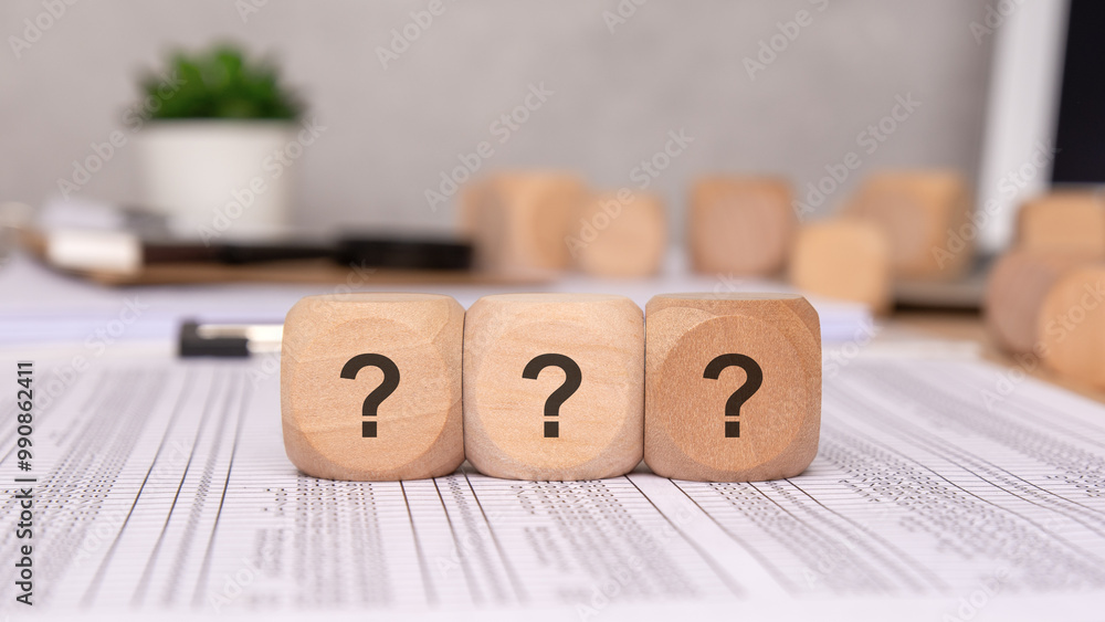 Poster question marks on wooden blocks representing inquiry and curiosity in various contexts
