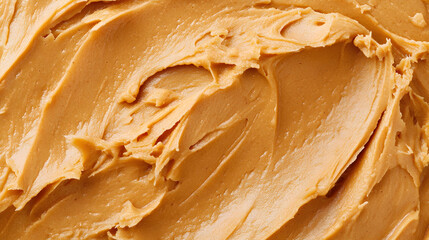 Creamy peanut butter spread texture top view