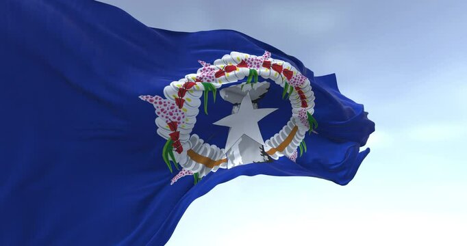 Flag of the Northern Mariana Islands waving in the wind on a clear day