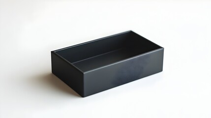 Minimalist matte black rectangular storage box with a single compartment photographed against a pure white background