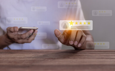 Excellence Review, Young Man using smartphone hand touching five star to review and give 5 stars with very good results in service, Good review 5 star rating choice feedback