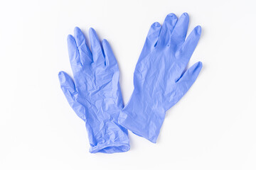 Blue nitrile gloves on white background. Top view