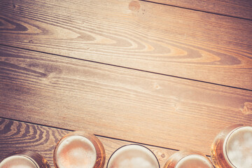 Beer glasses on wooden table