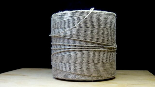 Rotating spool of fine twine rope