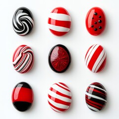 Obraz premium Colorful collection of red and black decorative stones with unique patterns, perfect for artistic projects and design inspiration.