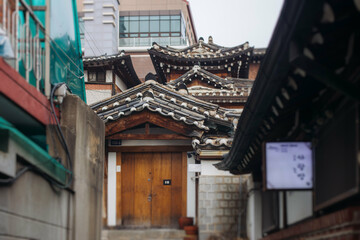 Fototapeta premium Bukchon Hanok Village, Jongno District, Seoul, South Korea, streets with traditional korean houses, travel to South Korea concept in a spring sunny day