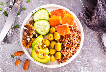 Buckwheat salad with smoked salmon, cherry tomato, red onion and greens