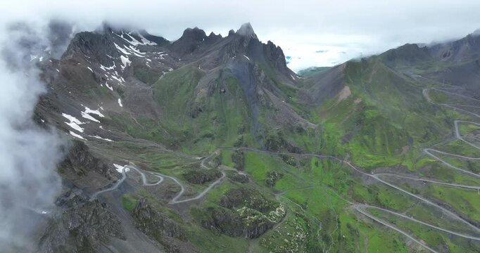 Aerial footage of beautiful high altitude snow capped mountain landscape