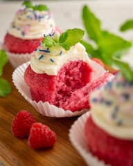 Red velvet muffins with sweet and caramel frosting.