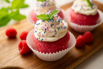 Red velvet muffins with sweet and caramel frosting.