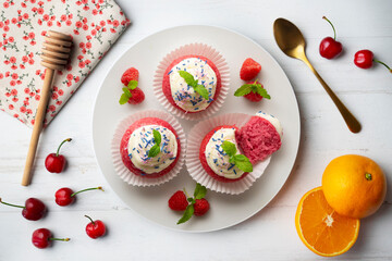 Red velvet muffins with sweet and caramel frosting.