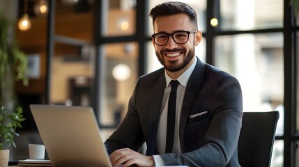 Fototapeta premium Smiling Businessman Working on Laptop in Office with Positive Attitude
