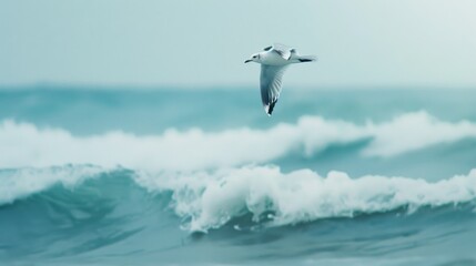 A solitary seagull gracefully glides above the rolling ocean waves on a cloudy day, capturing the essence of freedom and nature's beauty.