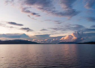 panoramic aerial view of sunrise over the sea and mountains with clouds