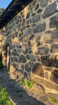 Rustic Stone Wall of Buron in Cantal, Auvergne at Sunset &ndash; Traditional French Architecture, Volcanic Stone Texture, Rural Heritage Building, Warm Natural Light, Mountain Landscape, France