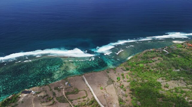 Ocean with swell waves and largest rip current. Drone view of scenic seascape in Bali