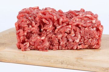 raw minced beef with wooden cutting board  isolated on white 