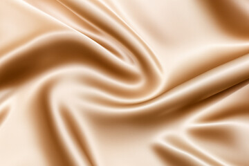 Obraz premium Close-up of soft, smooth, beige fabric with a gentle, flowing drape.