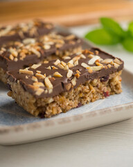 Homemade energy bars made with oats, nuts and chocolate.