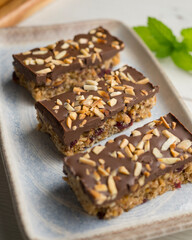 Homemade energy bars made with oats, nuts and chocolate.