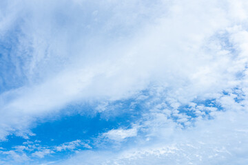 Fototapeta premium Beautiful blue sky with fluffy white clouds, a perfect summer day