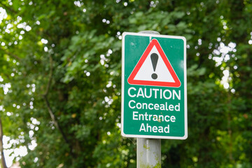 Warning sign concealed entrance ahead