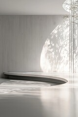 Curved bench adds a focal point in a minimalist room where soft, natural light creates intricate patterns on the wall.