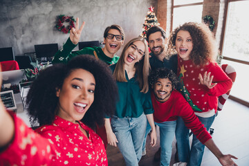 Photo of cheerful young people colleagues take selfie photo smile cozy christmas party decor spacious office indoors