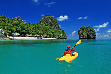 Tourist take a kayak to see the beauty of the island Koh Langka Jew (Langka Jew Island) in Chumphon...