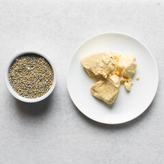 Overhead view of corn millet and nigerian akamu or pap, process of making akamu, flatlay of process of making nigerian akamu ogi pap or corn pudding