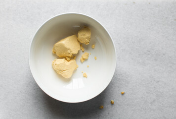Overhead view of nigerian akamu or pap paste, process of making akamu, flatlay of process of making...
