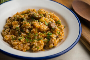 Rice paella with Iberian pork cheek. Traditional spanish tapa with iberic pork.