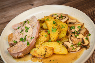 RECIPE VEAL ROAST, FRIES AND MUSHROOMS WITH SAUCE. High quality photo