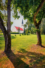 Amazing summer view of Sigulda Evangelical Lutheran Church. Sunny morning cityscape of Sigulda town, Siguldas novads, Latvia, Europe. Traveling concept background.