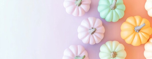 Obraz premium Get into the festive spirit with this autumnal decoration framing a colorful gradient background, perfect for adding your own message. Capture the essence of the season with pumpkins and pastel hues