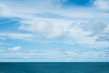 Beautiful nature view soft oceans waves with a deep blue color on the sea and clear sky with white clouds background in morning, Relaxing with nature view