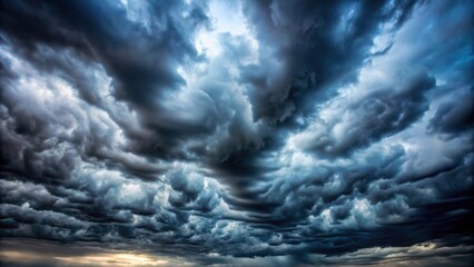 Obraz premium Moody overcast sky with fleecy clouds texture creating ominous skies in cold windy weather