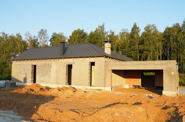 Villa construction. Prefab house under construction. Suburb house Construction. Prefabricated home...